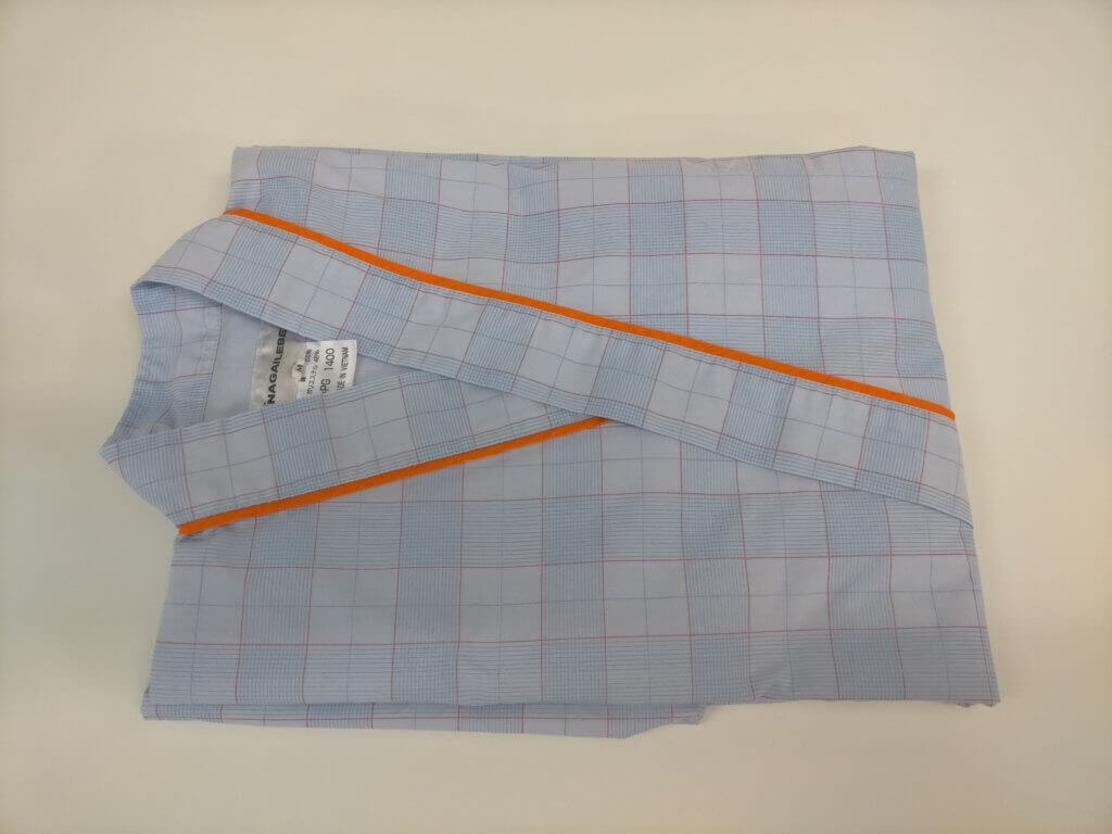 検査衣洗濯後たたまれてる